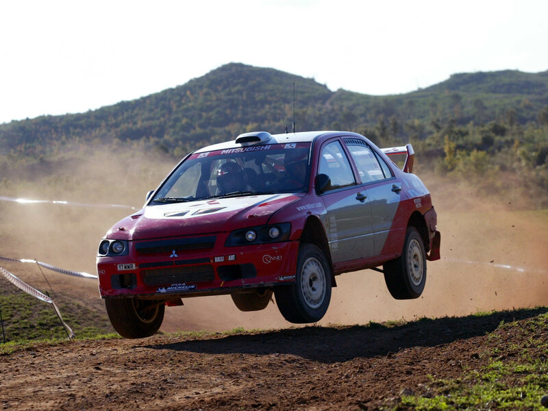 Red Rally Car in Mid-air
