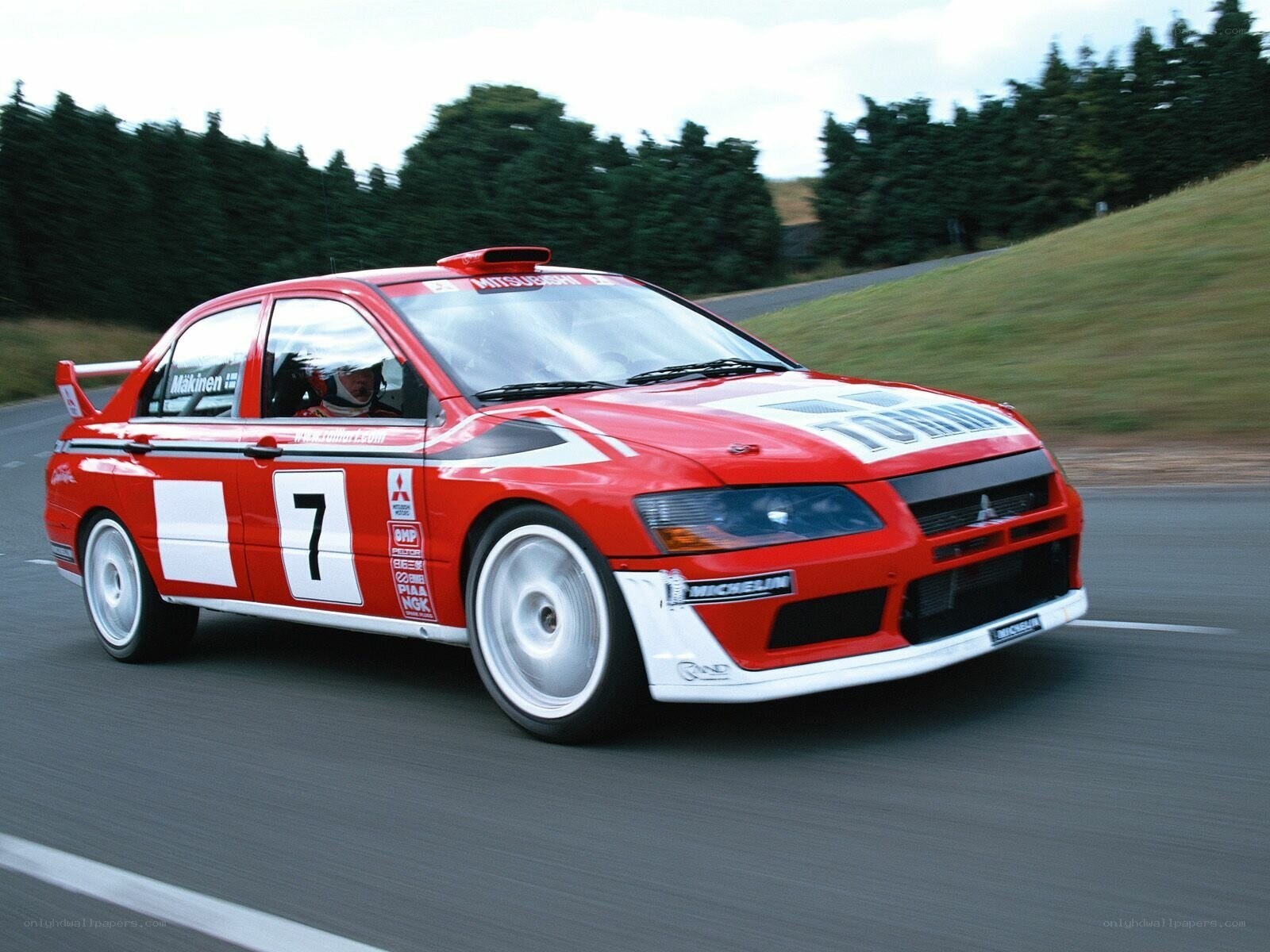 red rally car in motion