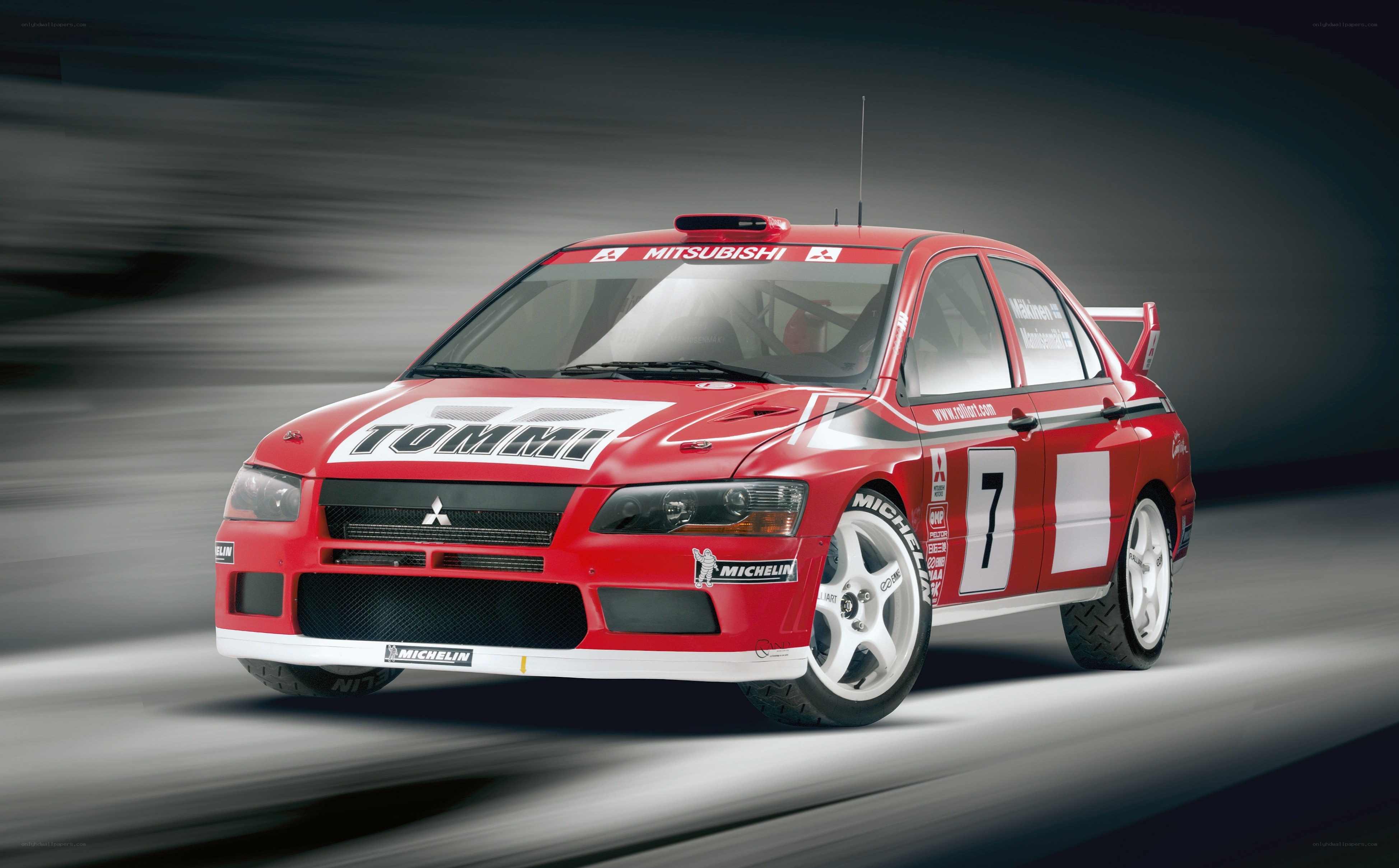 Red rally car in motion