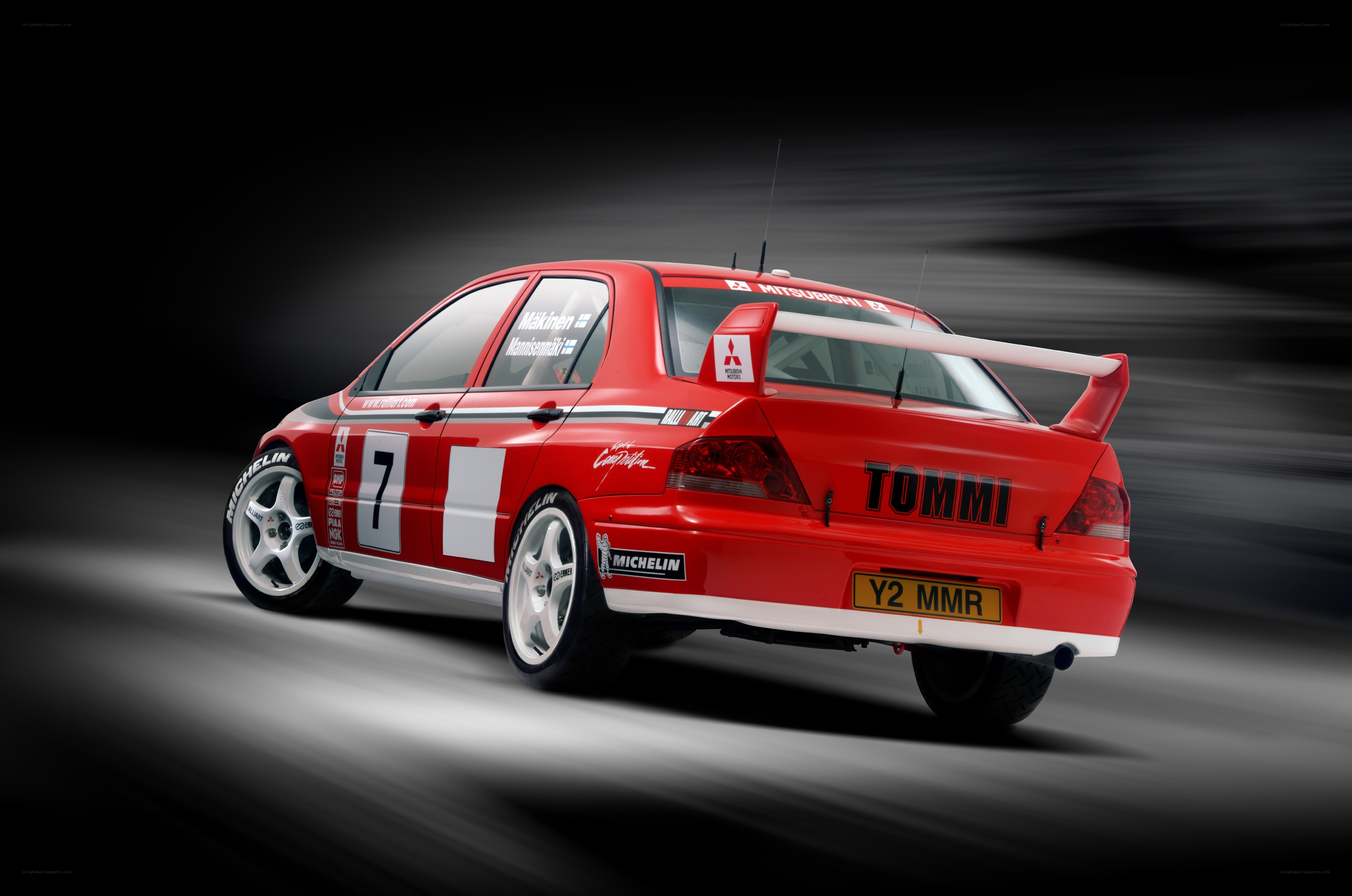 Red rally car in motion