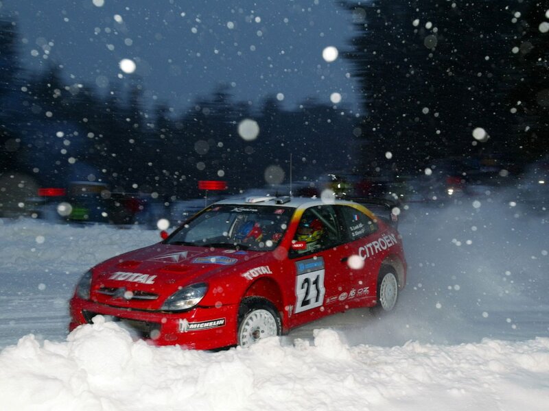 Red rally car in snow