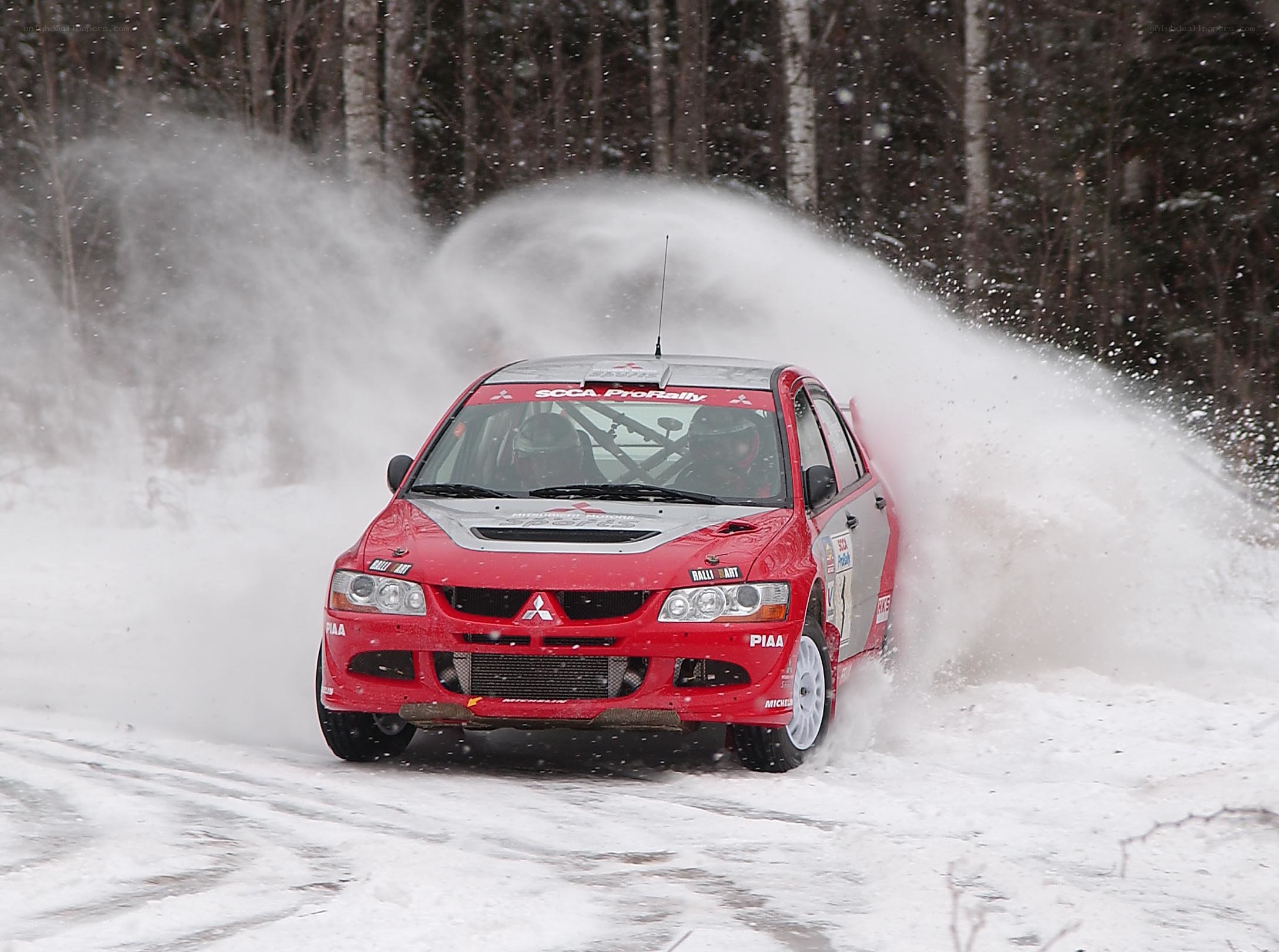 Red rally car in snow