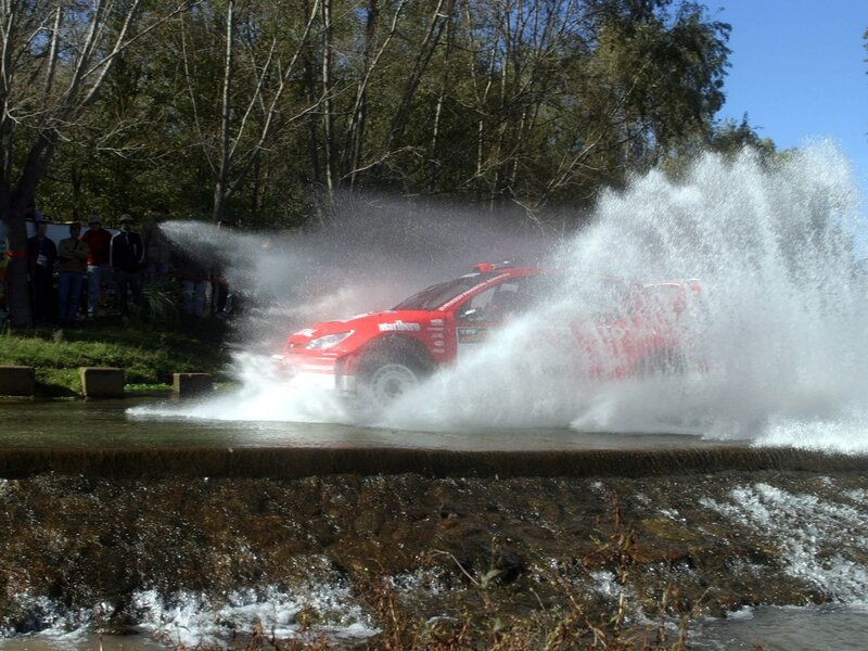 Red Rally Car in Water — Dynamic