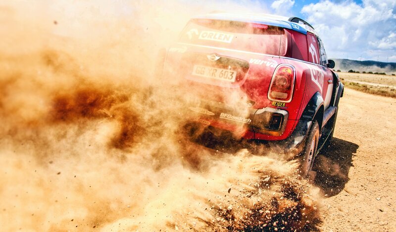 Red Rally Car Kicking Up Dust