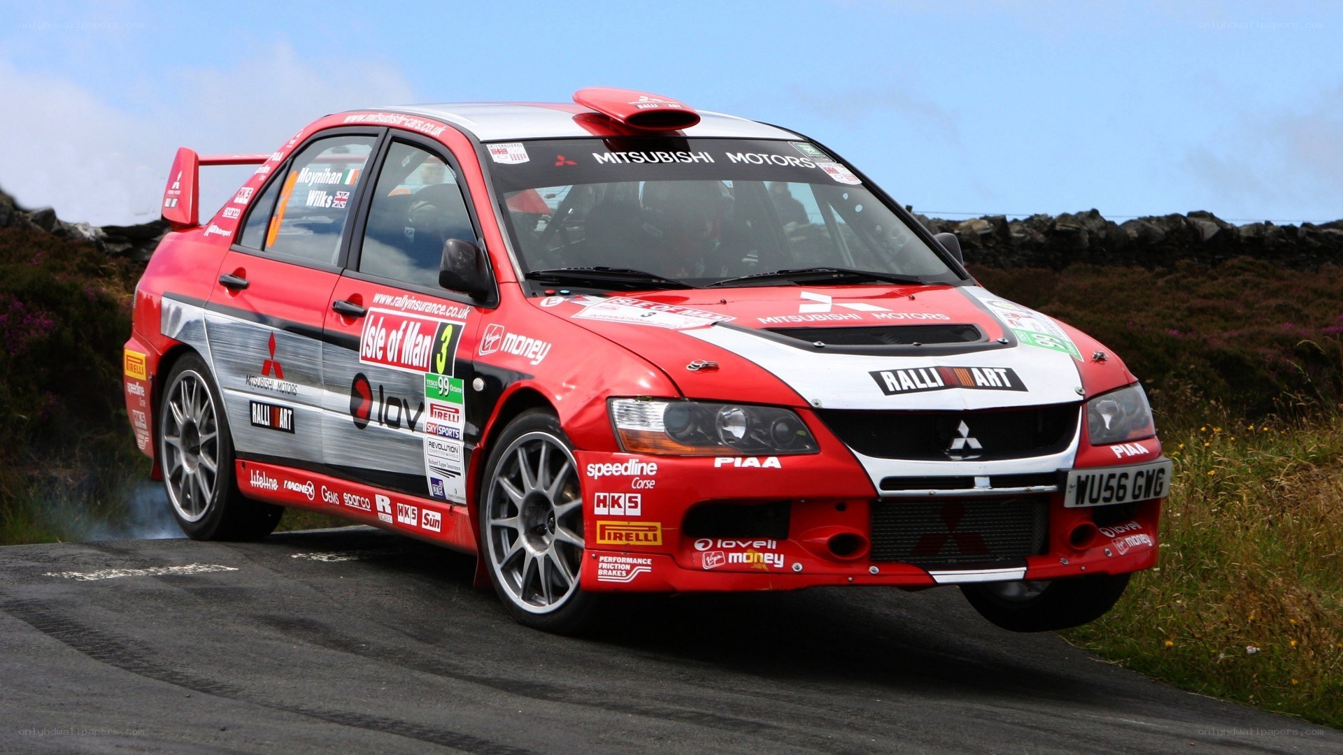 Red rally car on a road