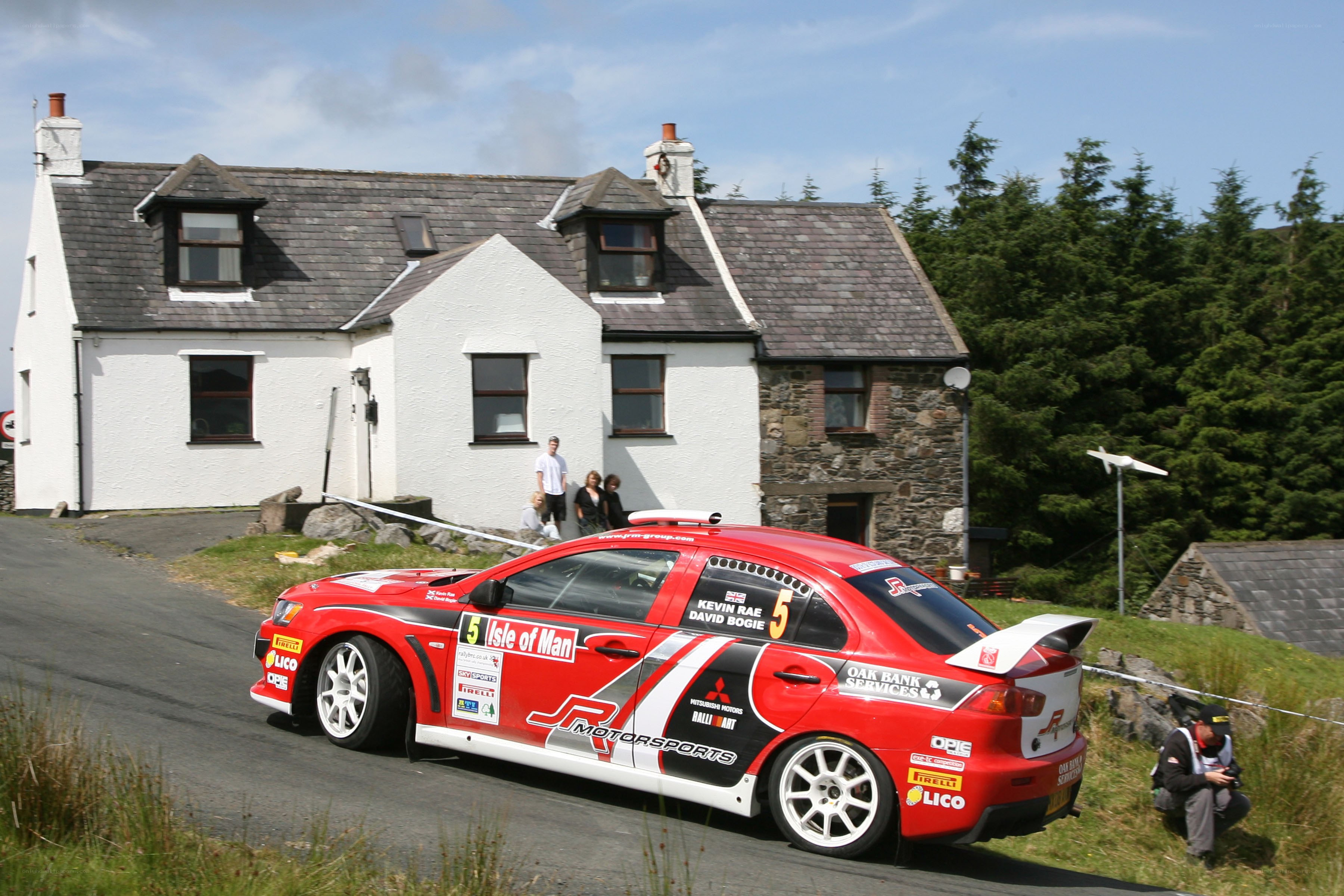 Red rally car on a road