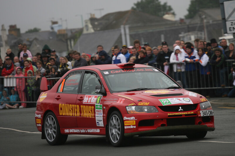 Red rally car on a street