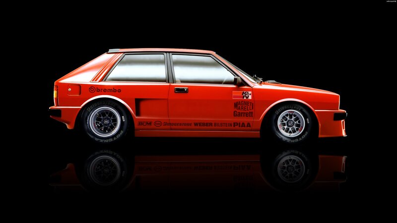 red rally car on black background
