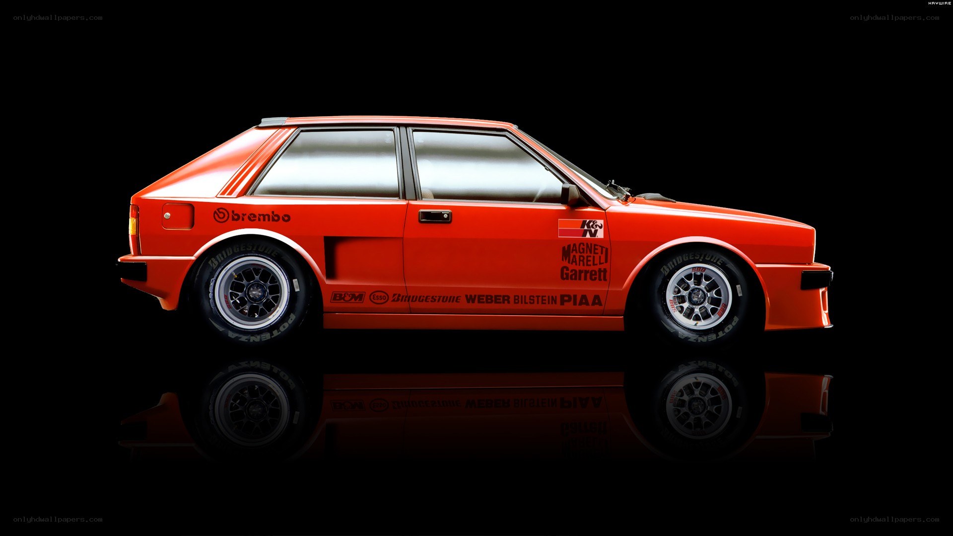 red rally car on black background