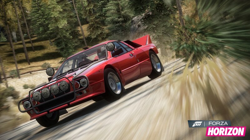 Red rally car on dirt road