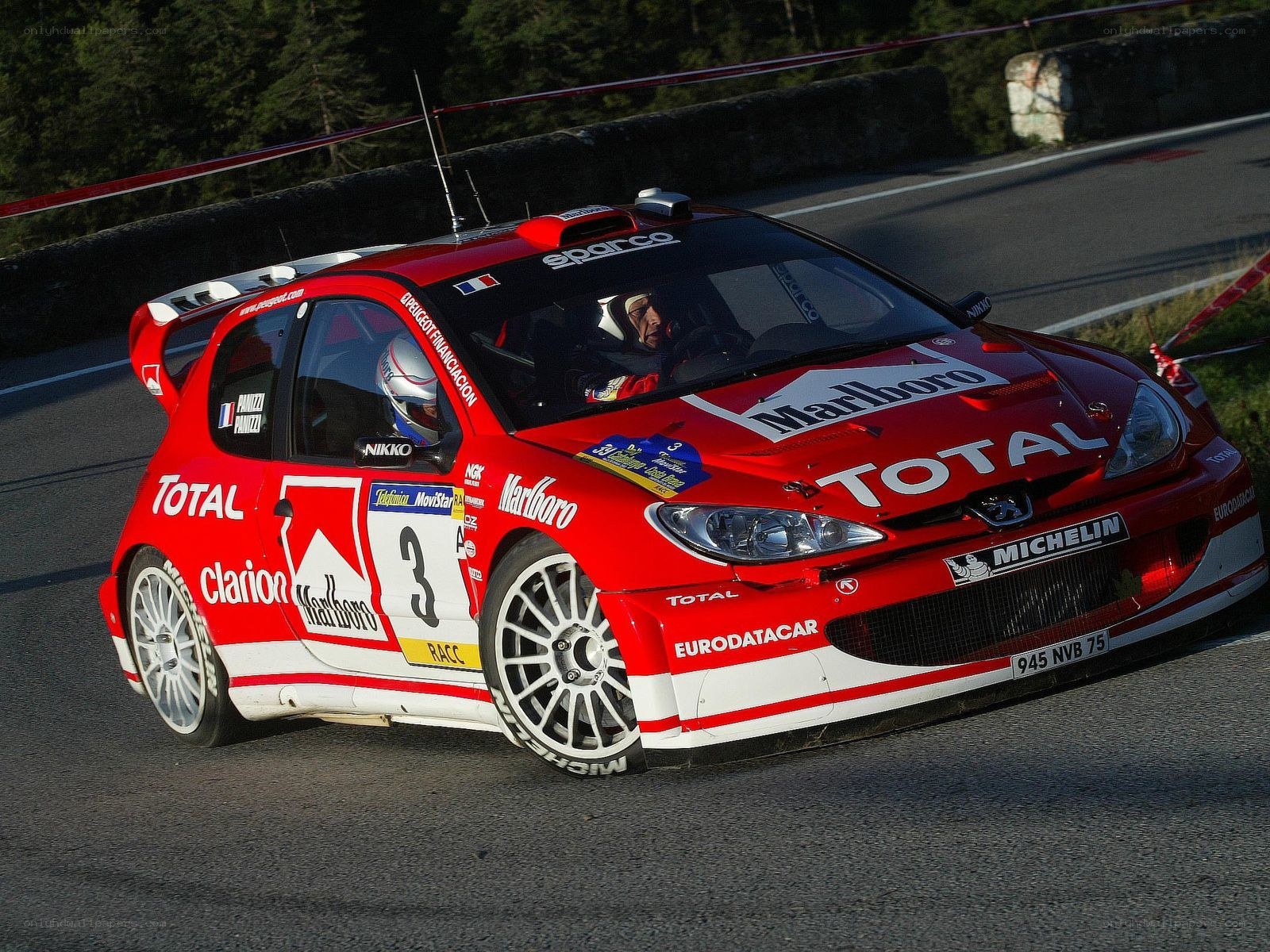 Red rally car on track