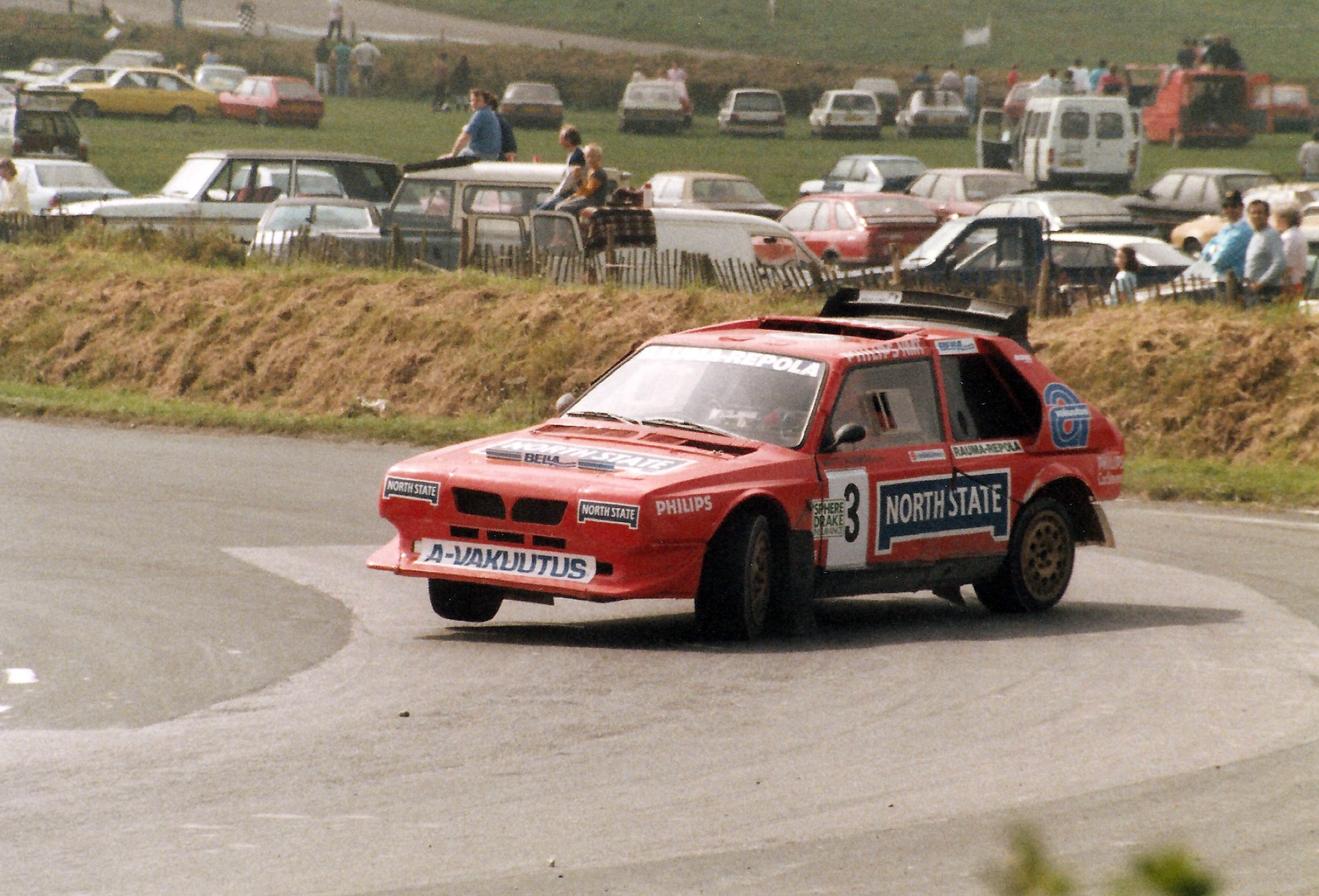 Red rally car on track