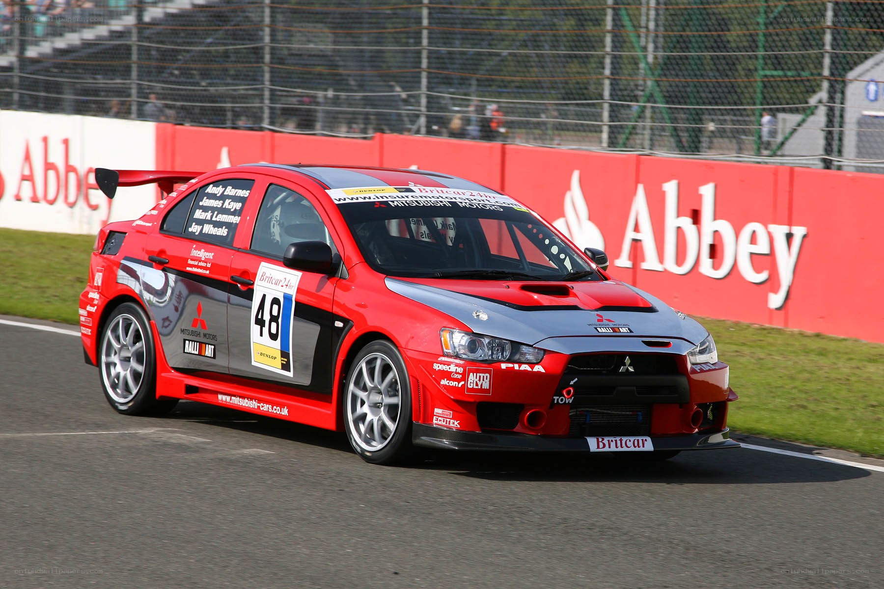 Red rally car on track