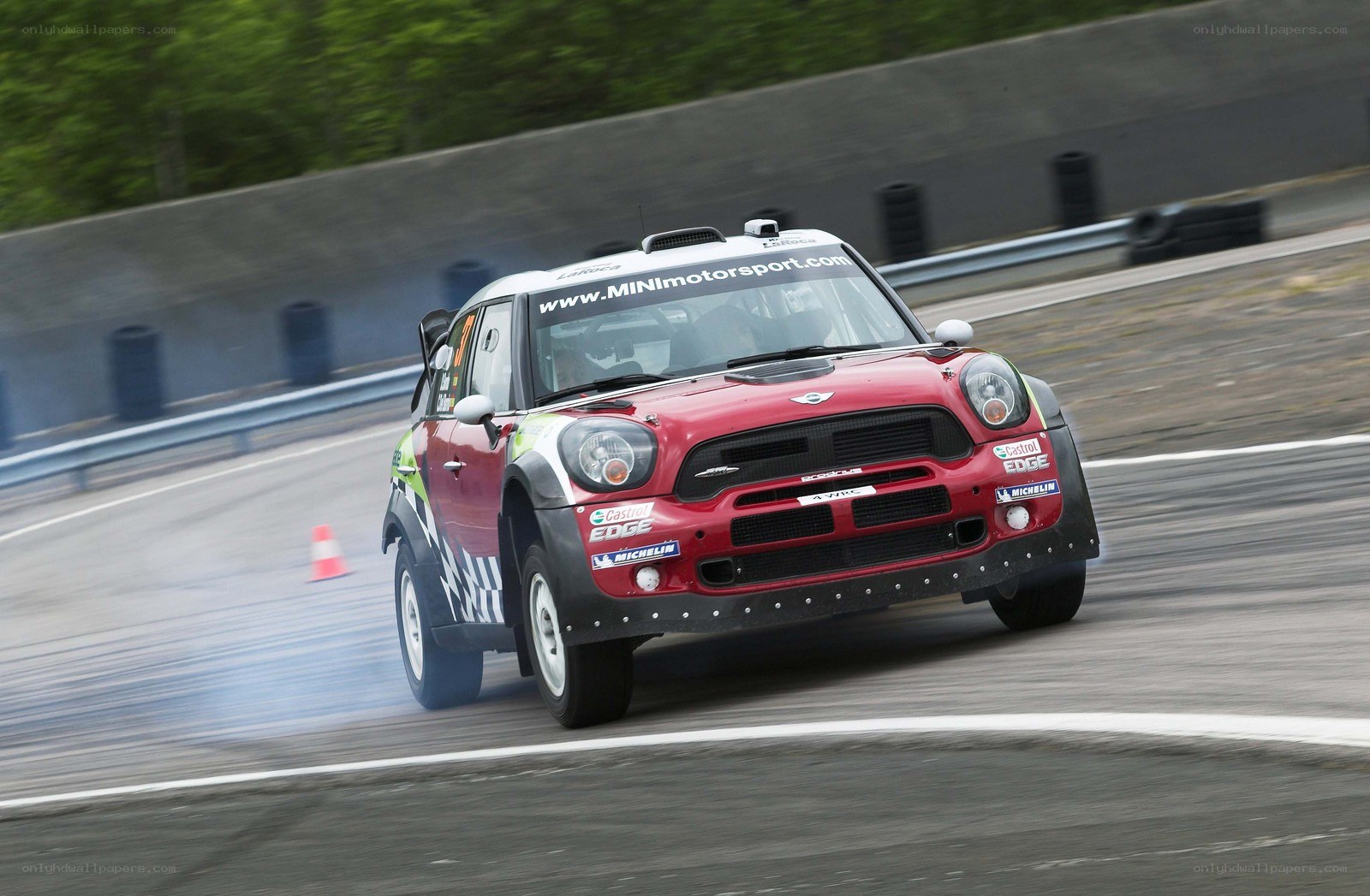 Red rally car on track