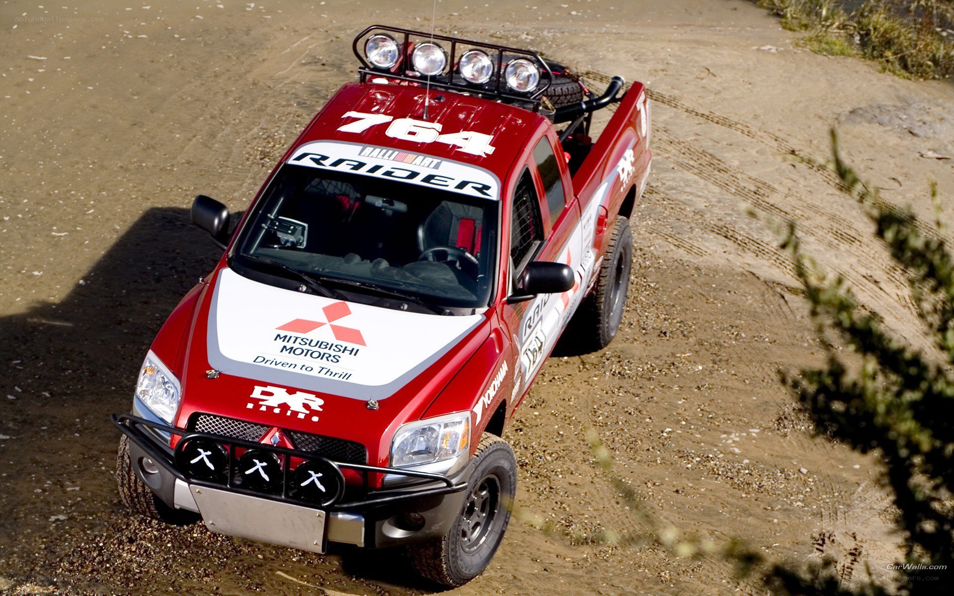 Red rally truck on dirt