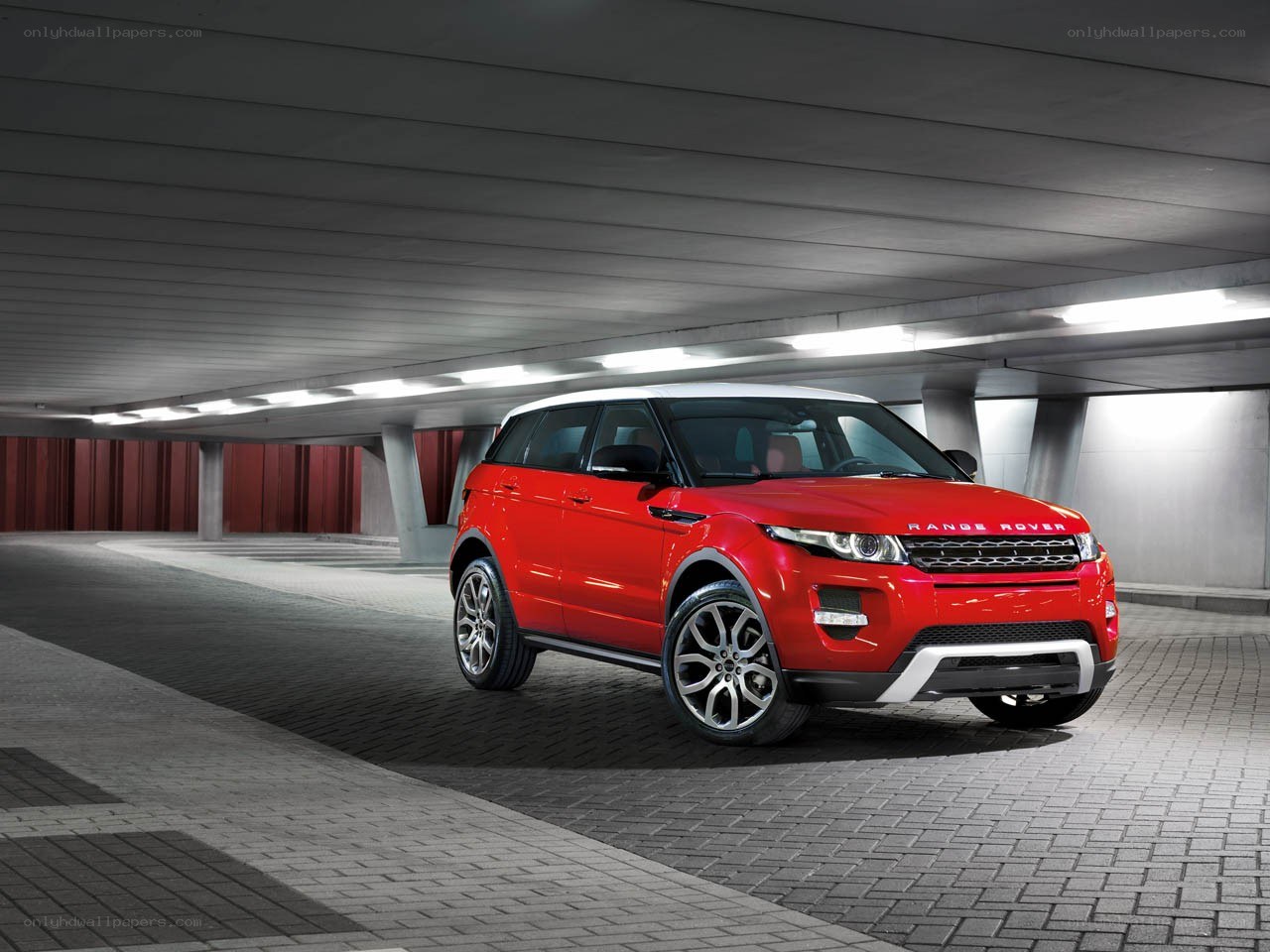 Red Range Rover Evoque in garage
