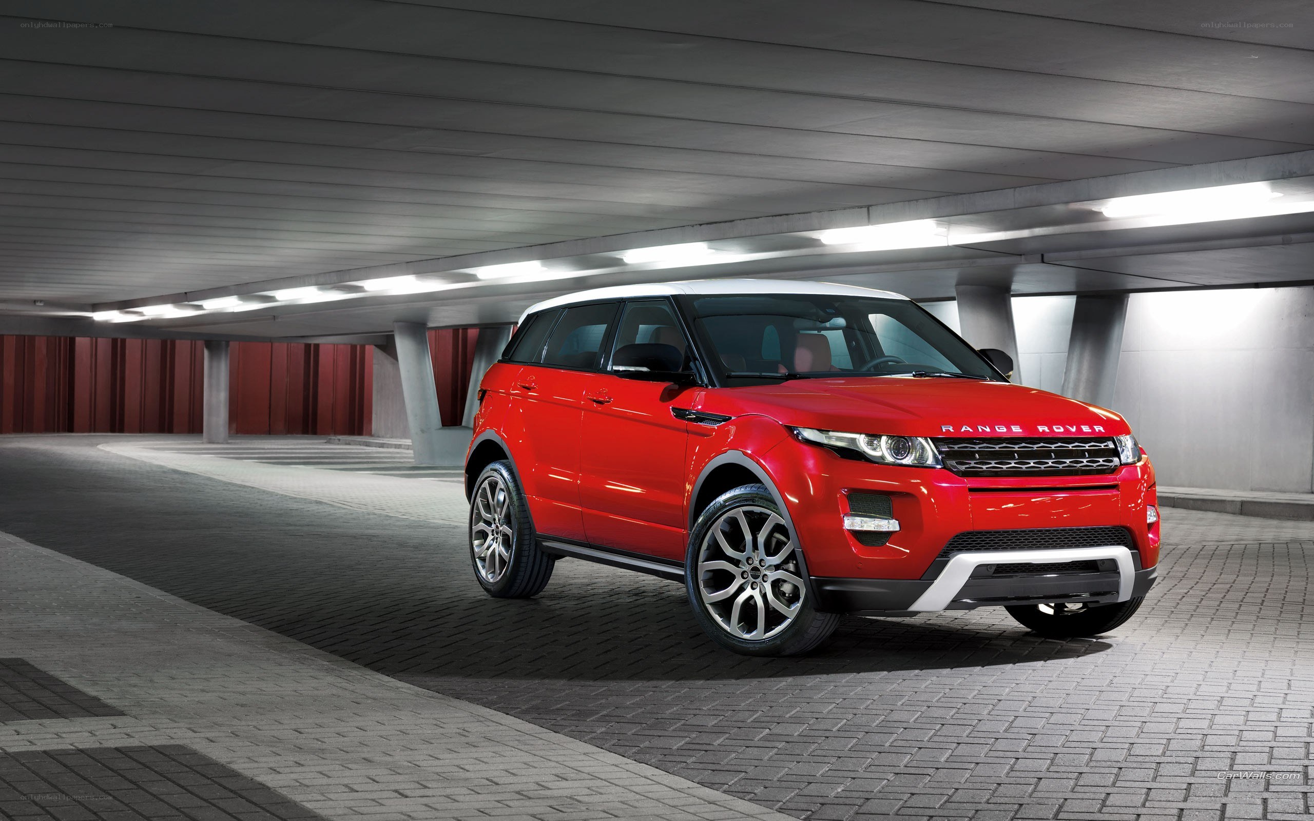 Red Range Rover Evoque in parking garage