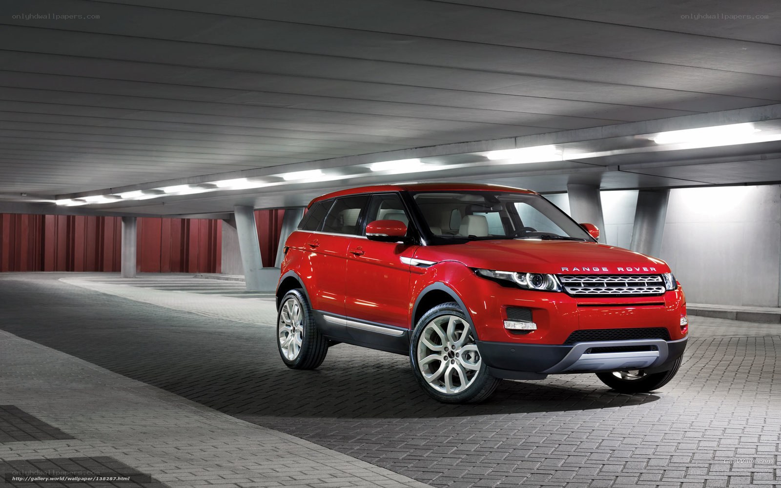 Red Range Rover Evoque in parking garage