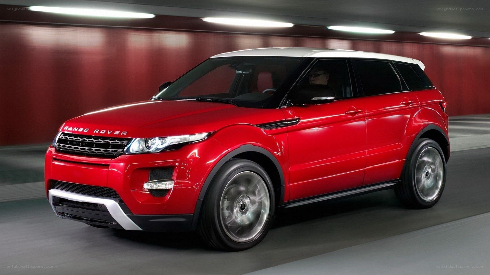 Red Range Rover Evoque in tunnel