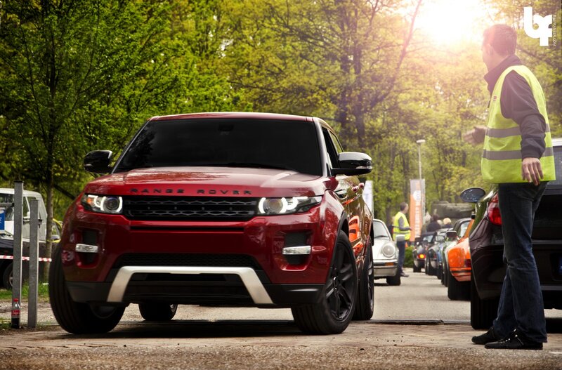 Red Range Rover in a car line