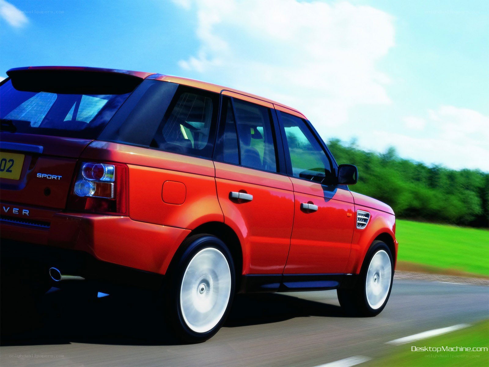 red range rover in motion
