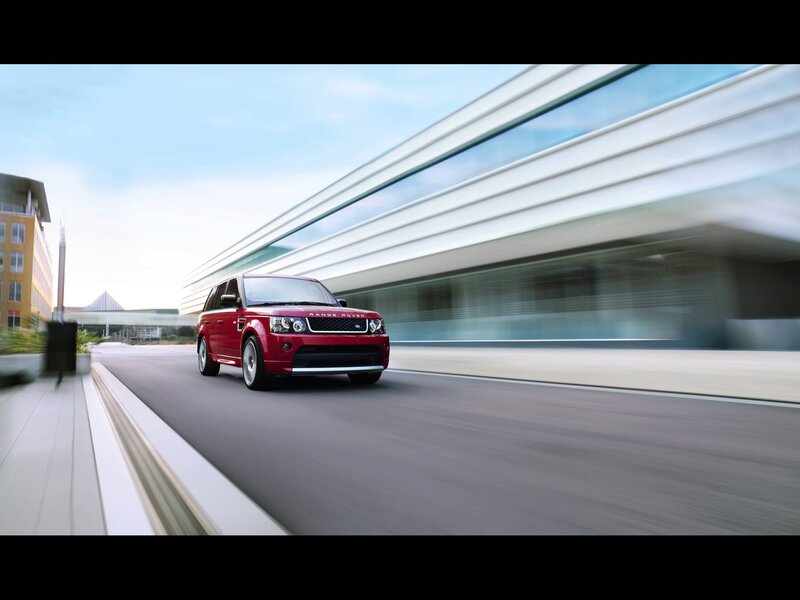Red Range Rover in motion