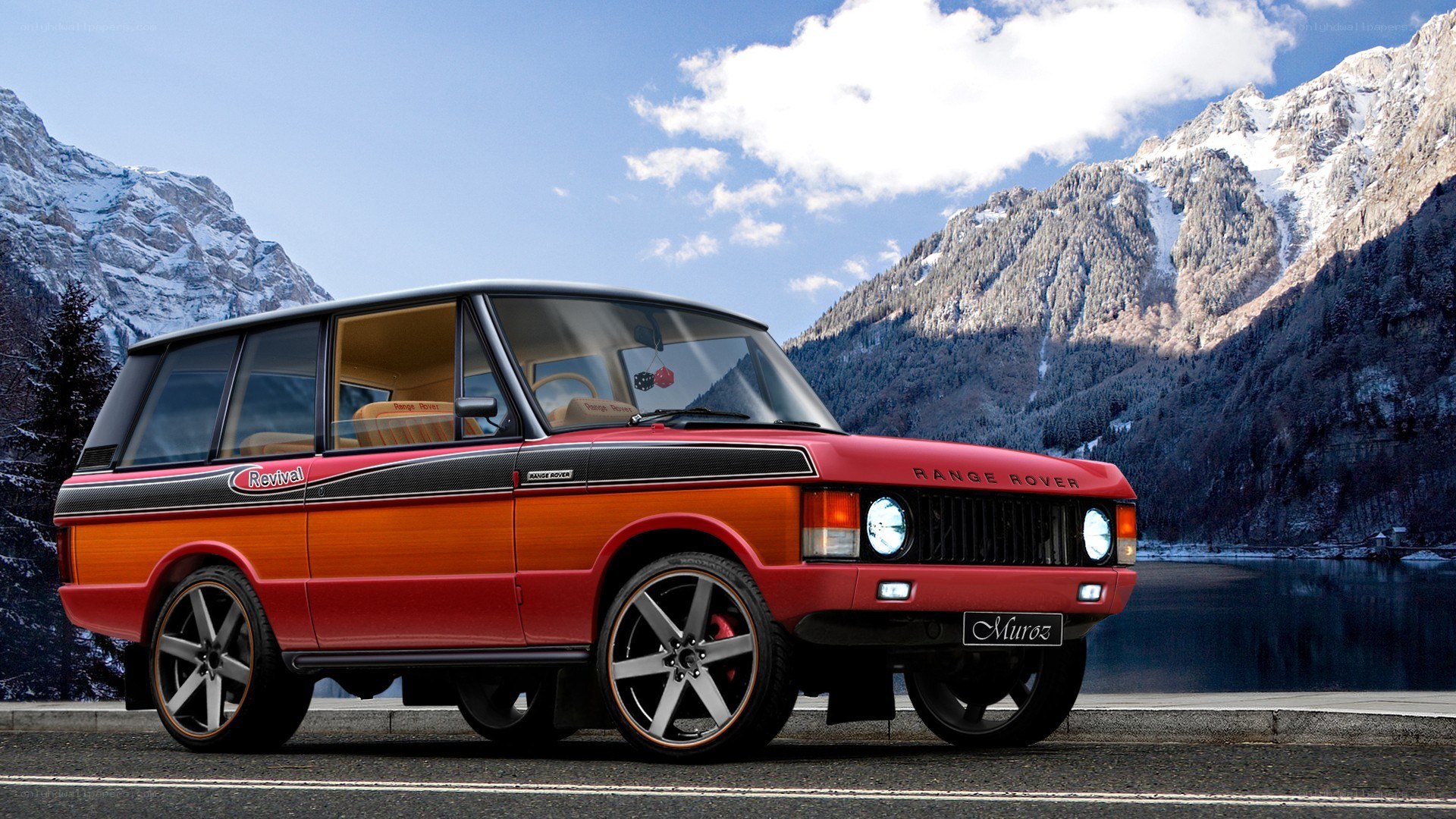 Red Range Rover in mountain scenery