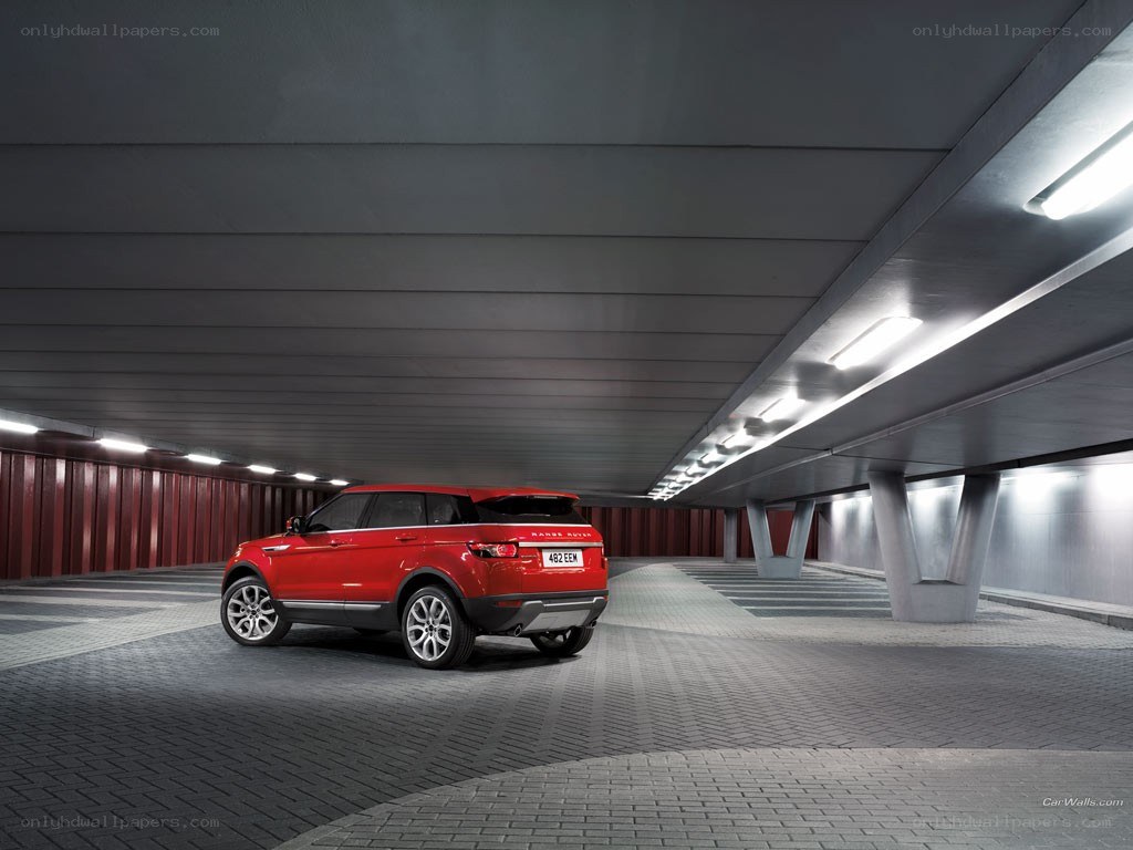 Red Range Rover in parking garage