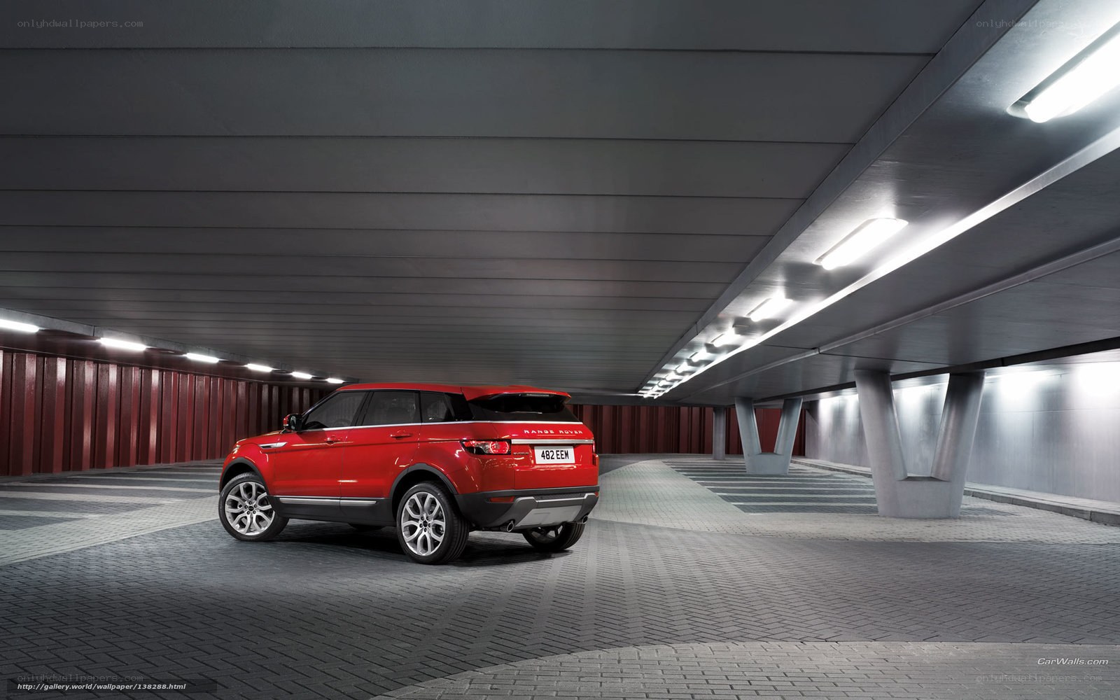 Red Range Rover in parking garage