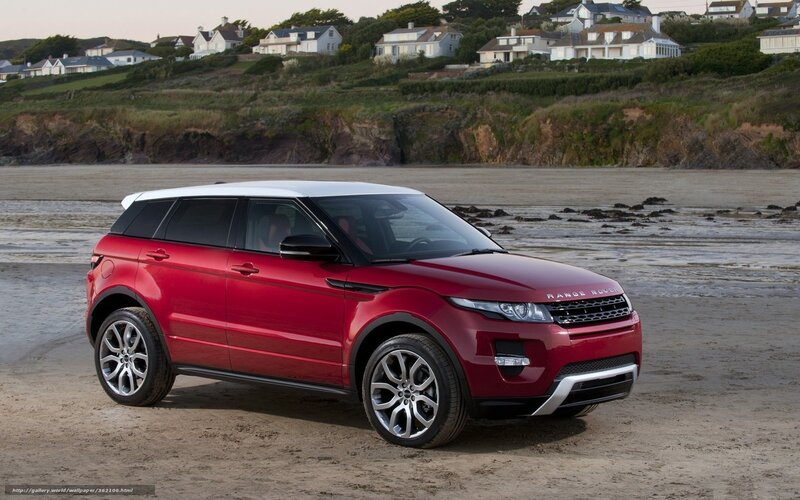 Red Range Rover on beach