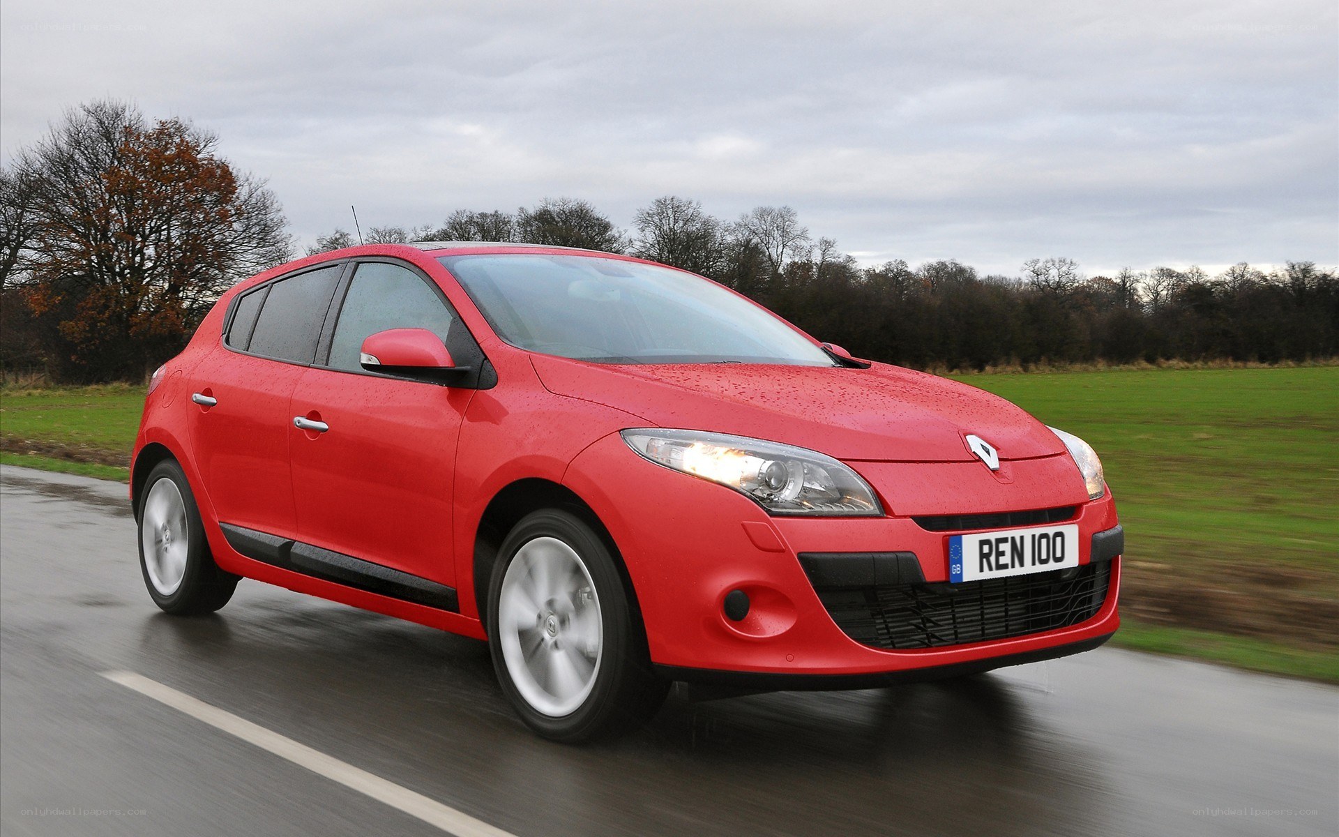 red renault car on road