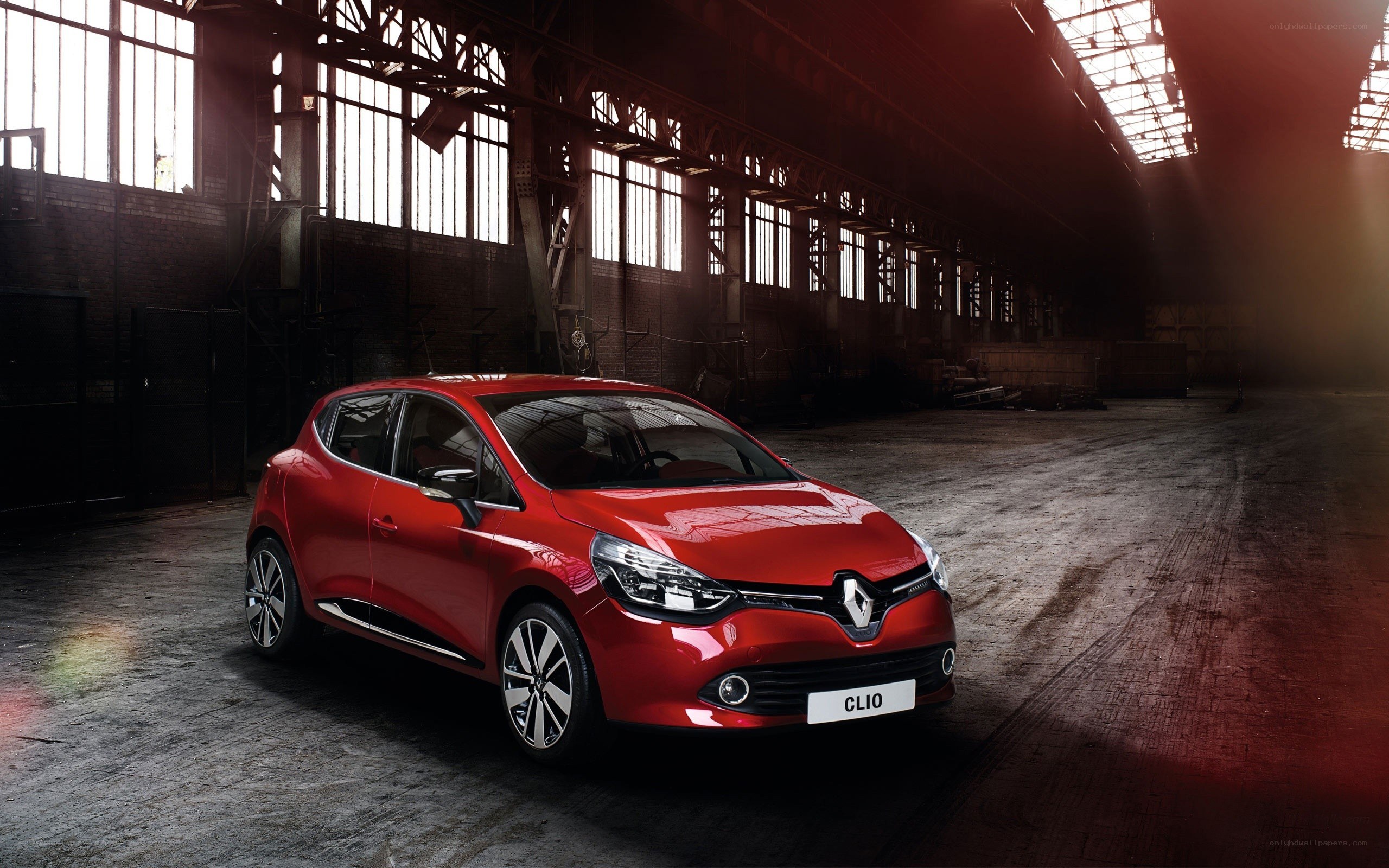 Red Renault Clio in warehouse