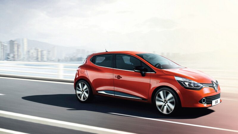 Red Renault Clio on a bridge