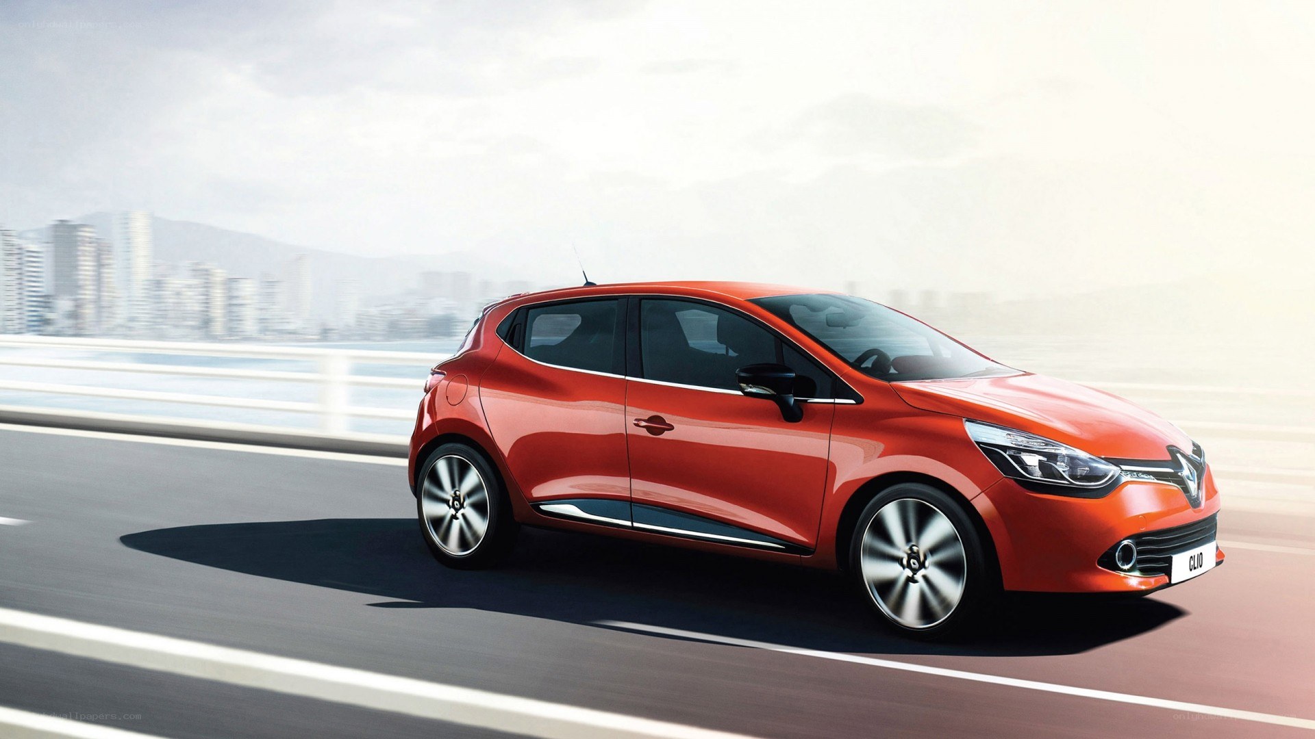 Red Renault Clio on a bridge