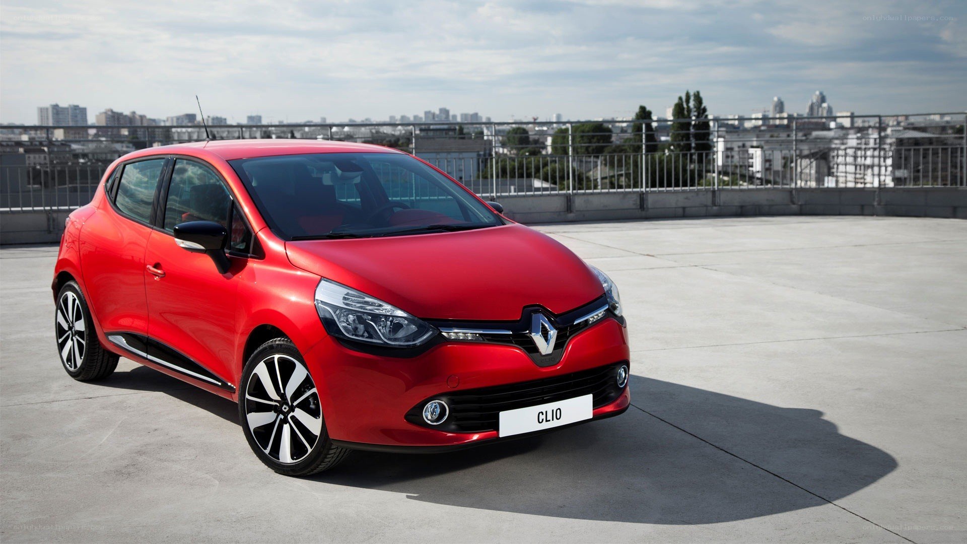 Red Renault Clio on rooftop