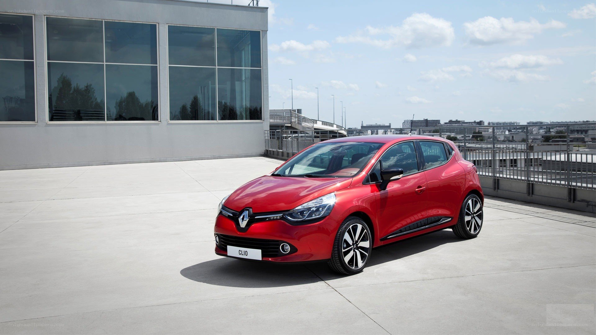 Red Renault Clio parked on rooftop