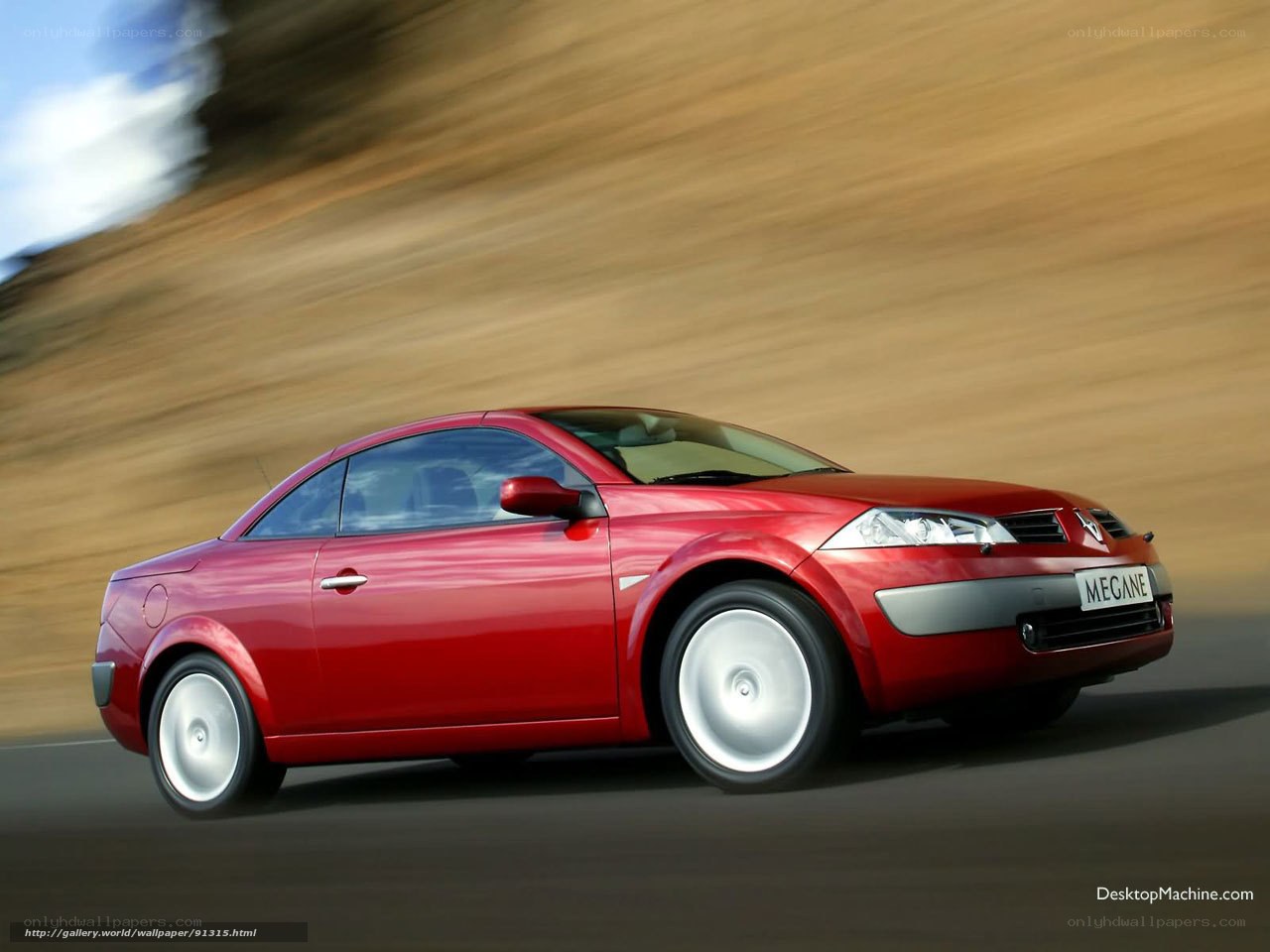 Red Renault Mégane Coupe in motion