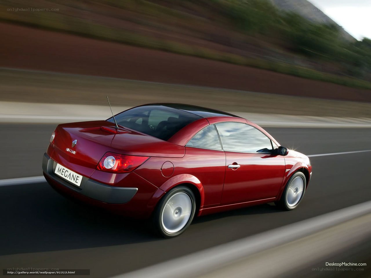 Red Renault Megane Cabriolet in motion