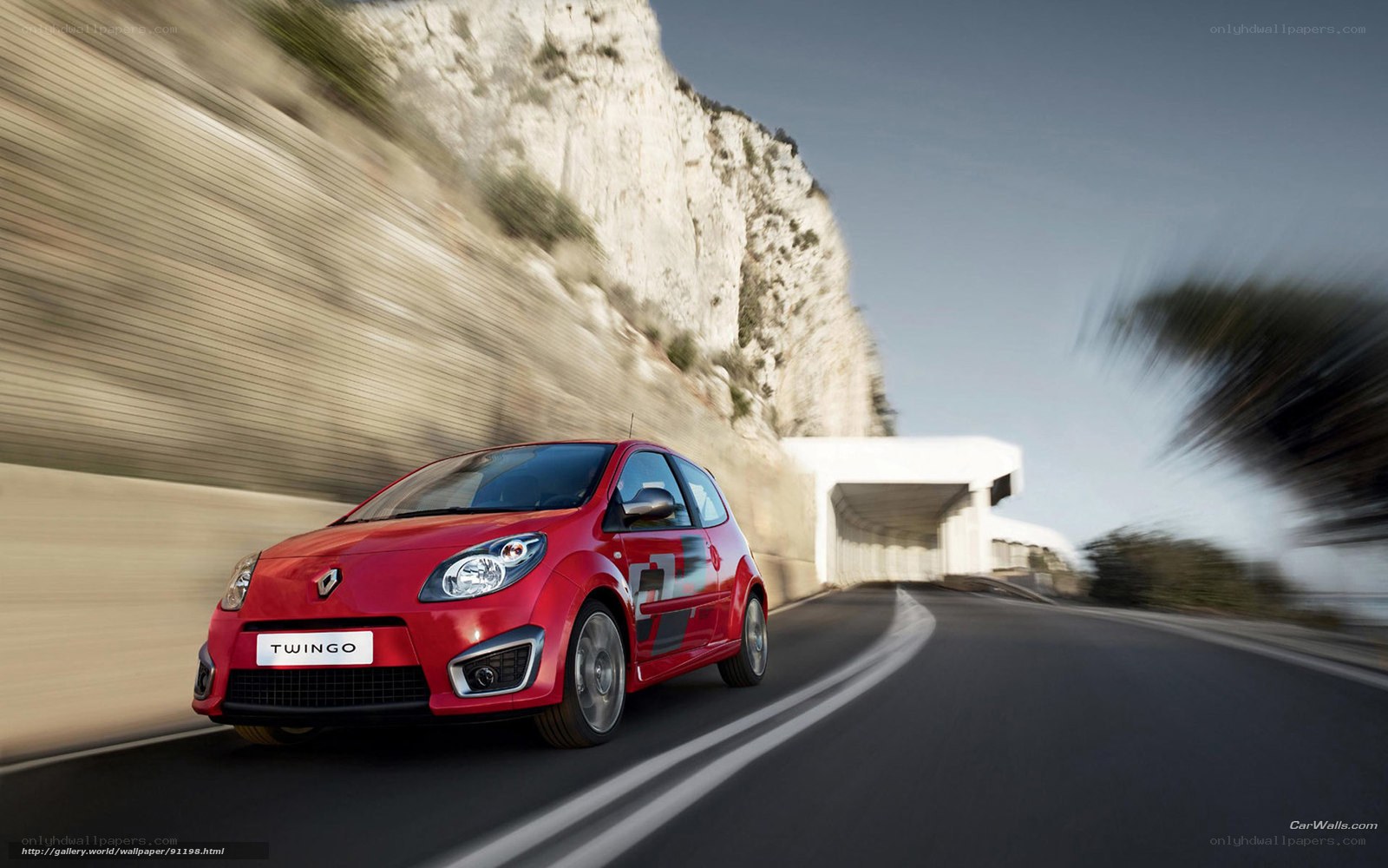 Red Renault Twingo on coastal road