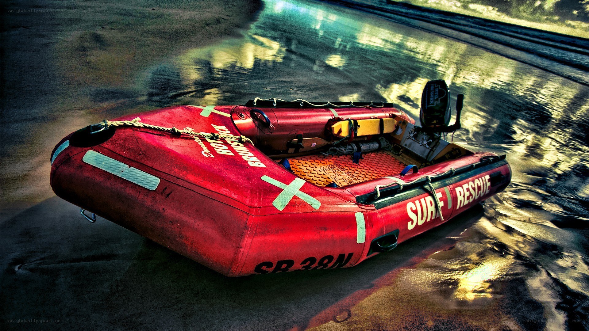 Red rescue boat on beach