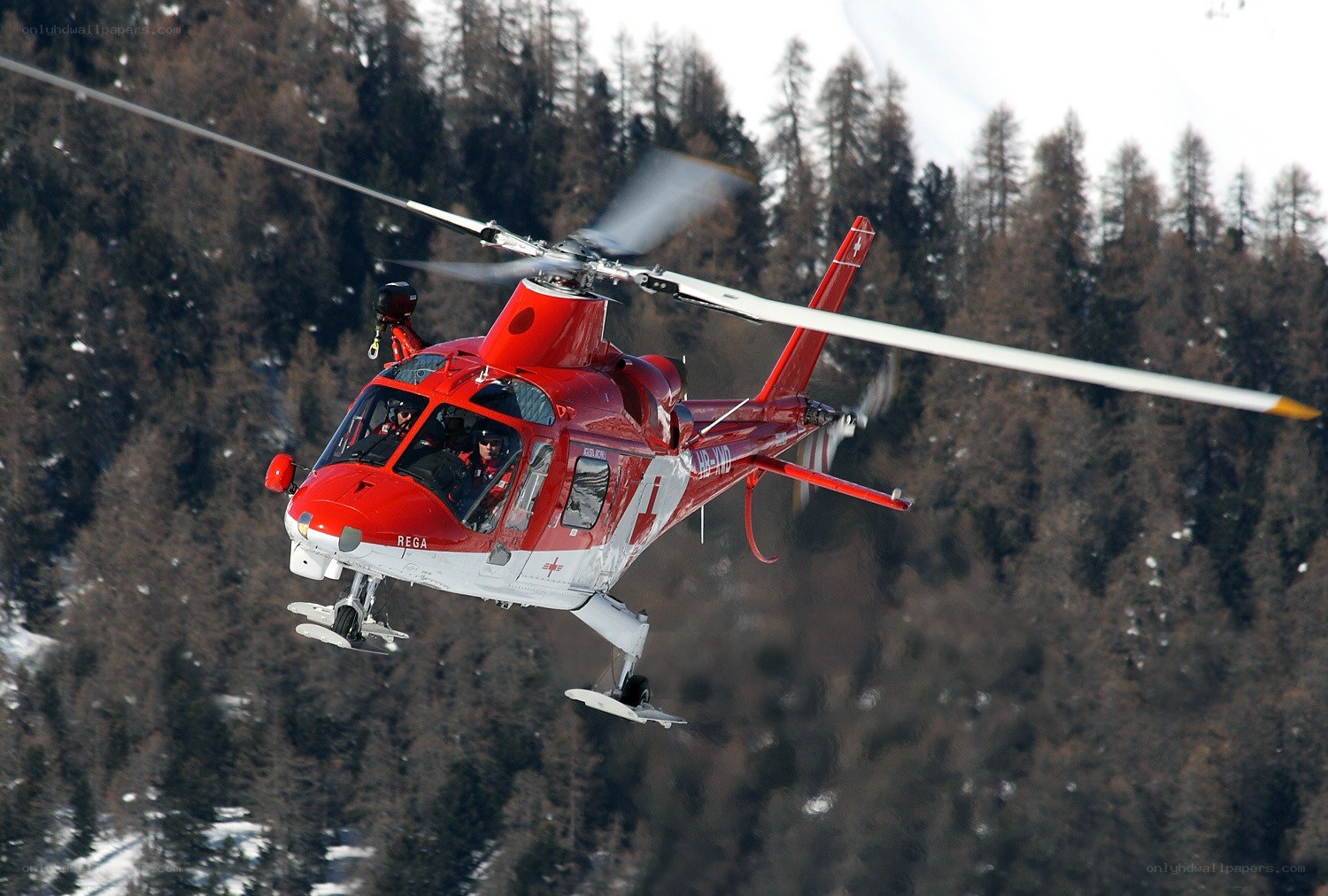 Red rescue helicopter in flight
