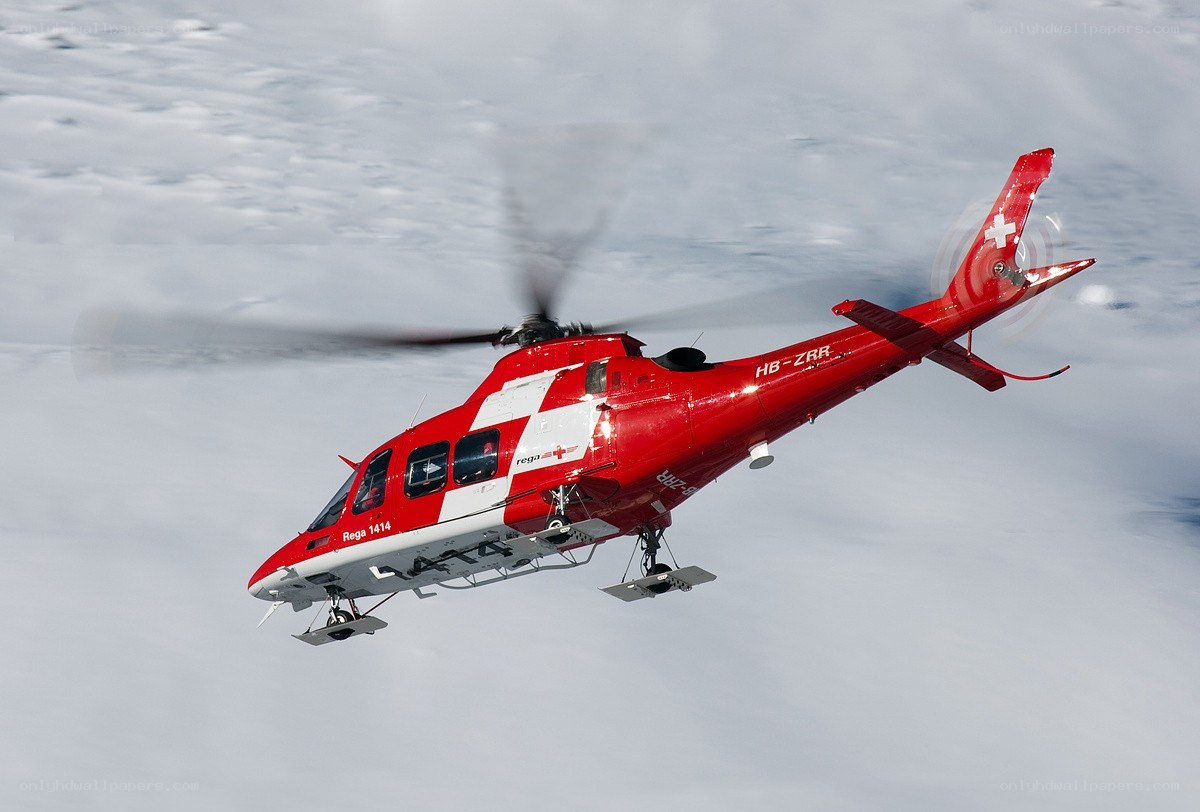 Red rescue helicopter in flight
