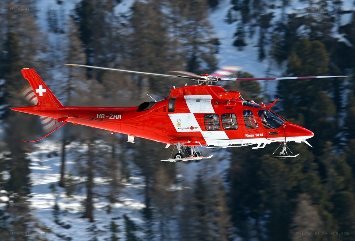 Red rescue helicopter in flight