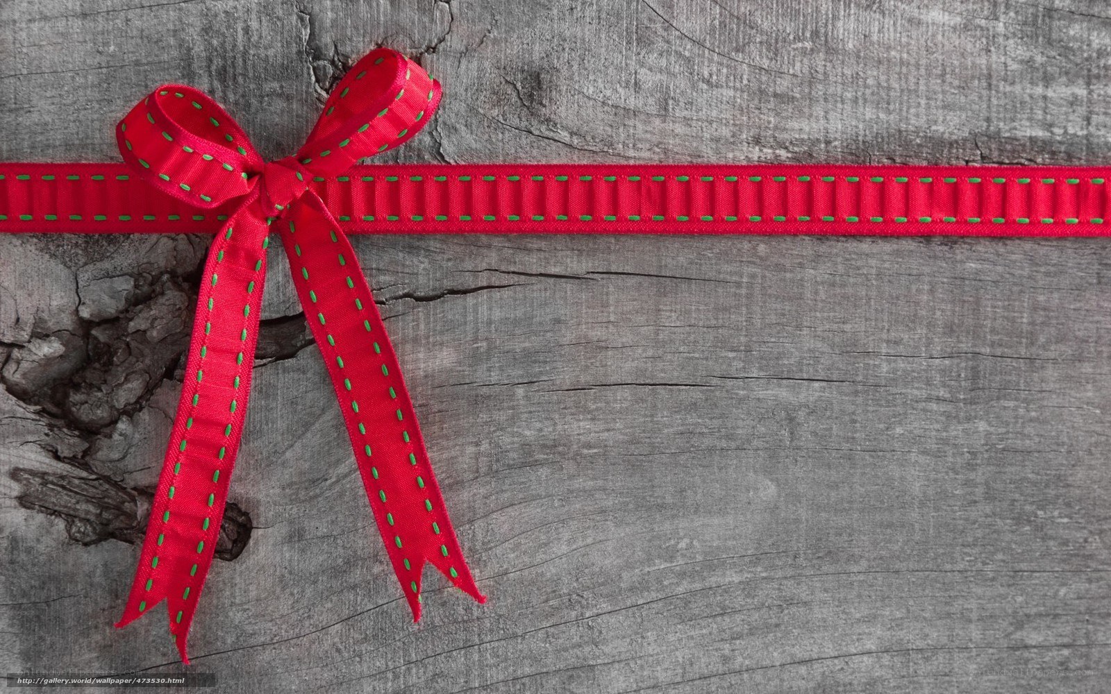 red ribbon on wood