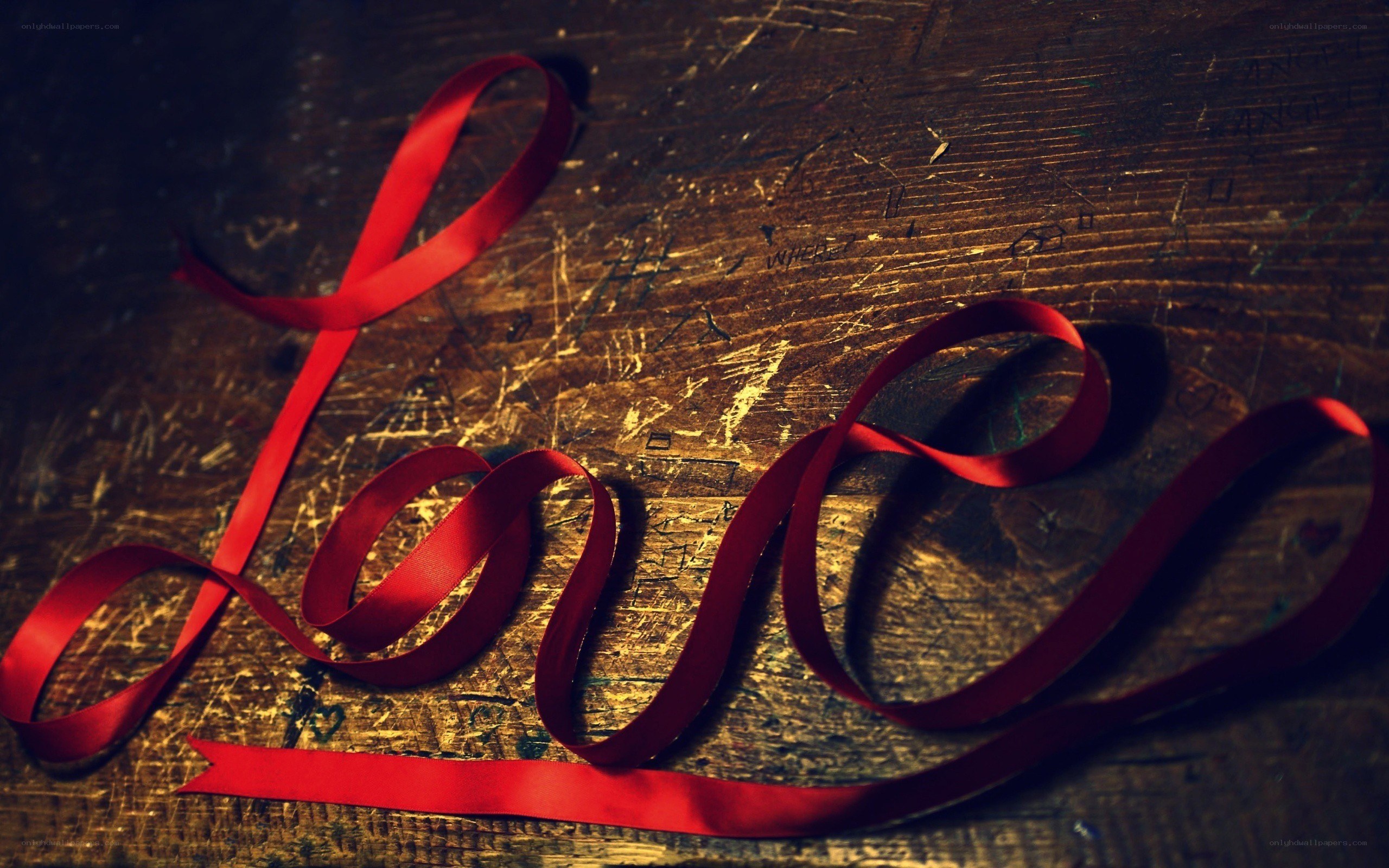 red ribbon spelling love