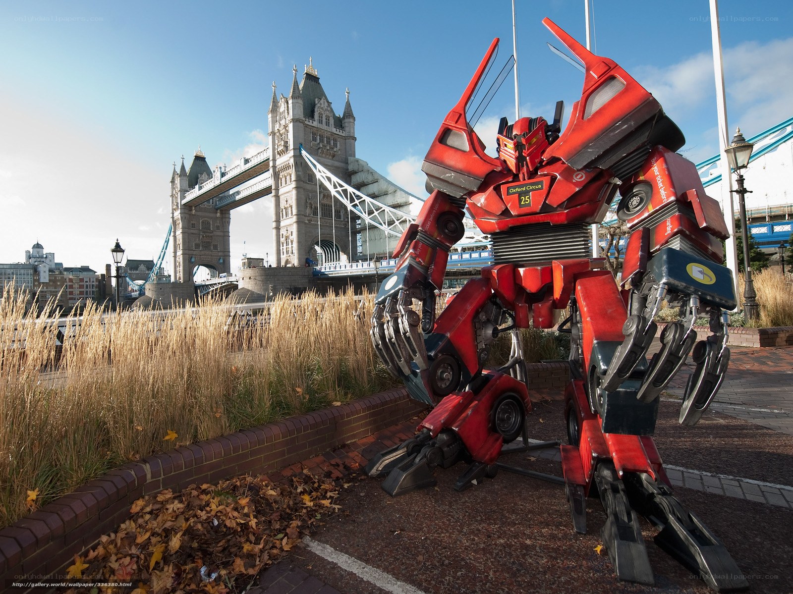 Red robot statue near Tower Bridge