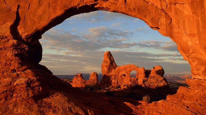 Red rock arch at sunset