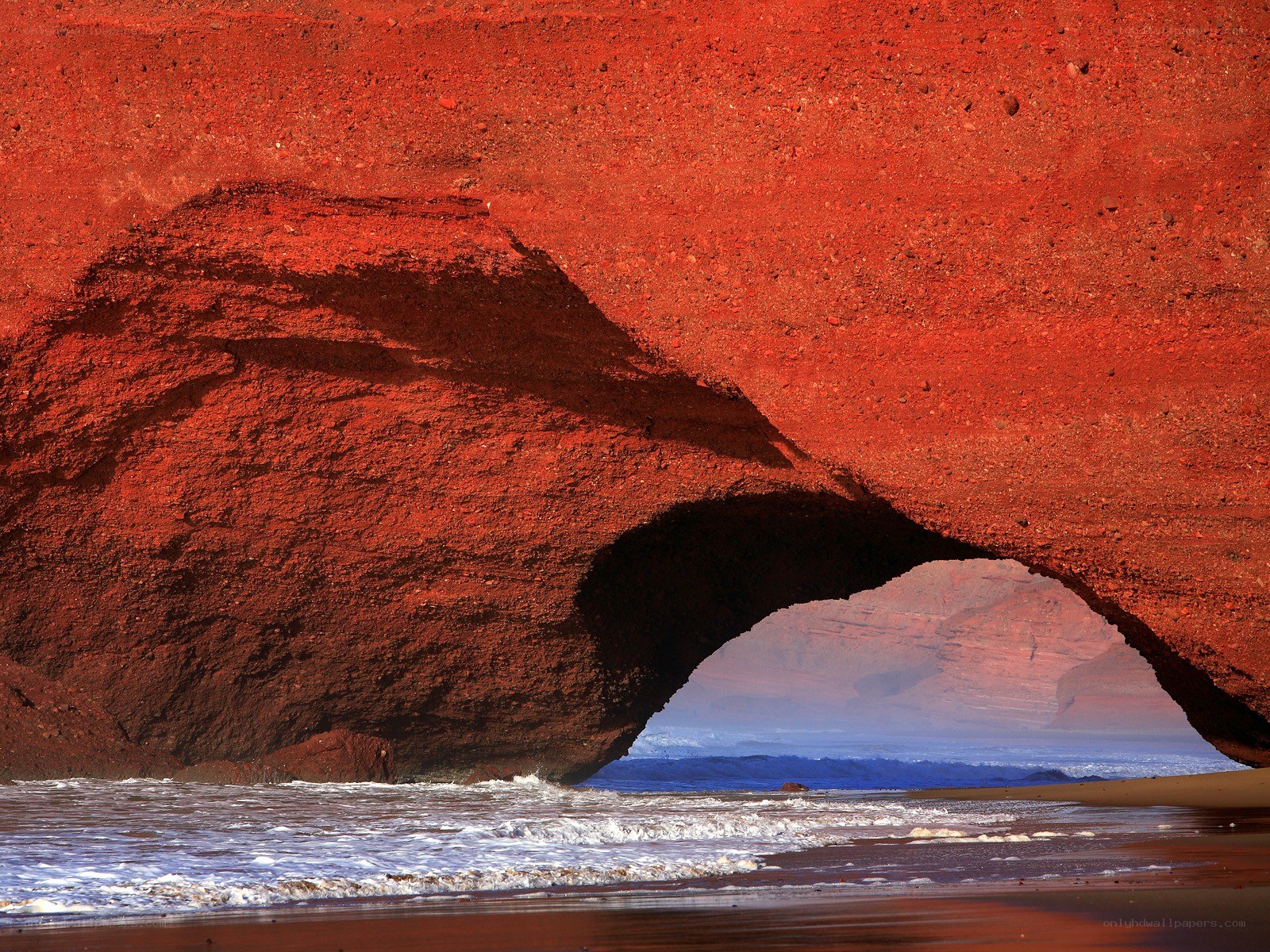 Red rock arch at the beach