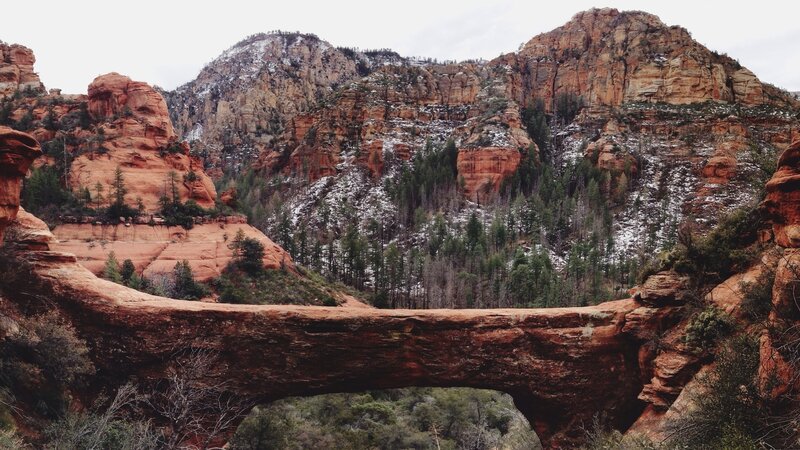 Red rock arch in snowy canyon