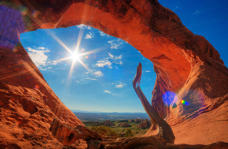 Red Rock Arch with Sun — Dramatic